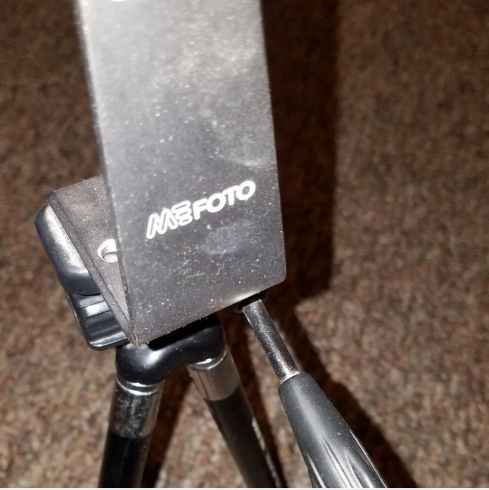 Tripod with phone adapter holster
